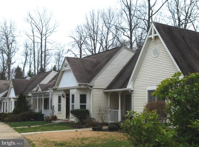 984 Riversedge Circle Annapolis, MD 21401 - Photo 10 of 14 a front view of a house with a yard and potted plants