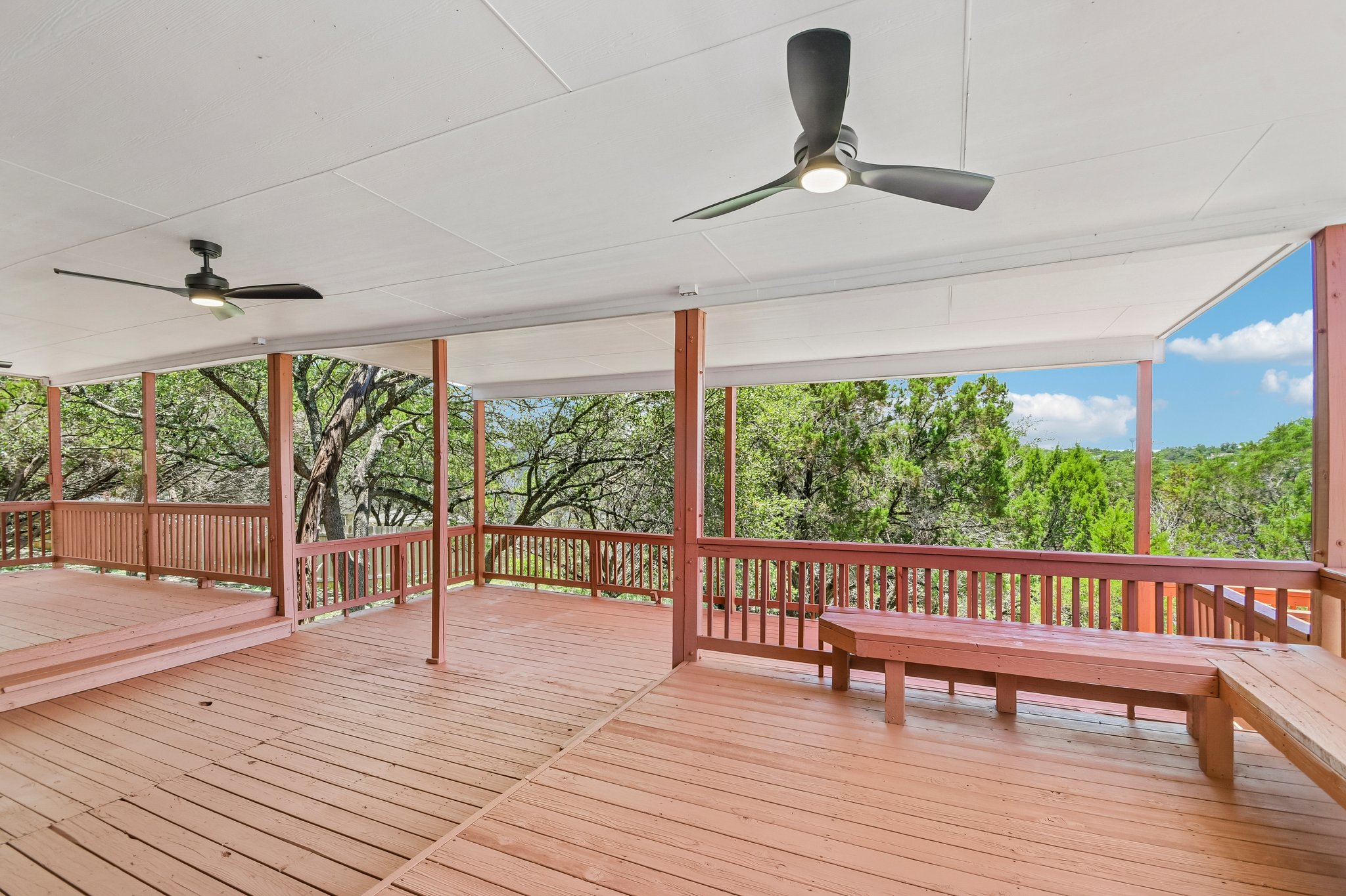 20609 Bridle Path Road Lago Vista, TX 78645 - Photo 7 of 30 An inviting covered patio offers ample space for entertaining with a verdant tree-lined outlook.