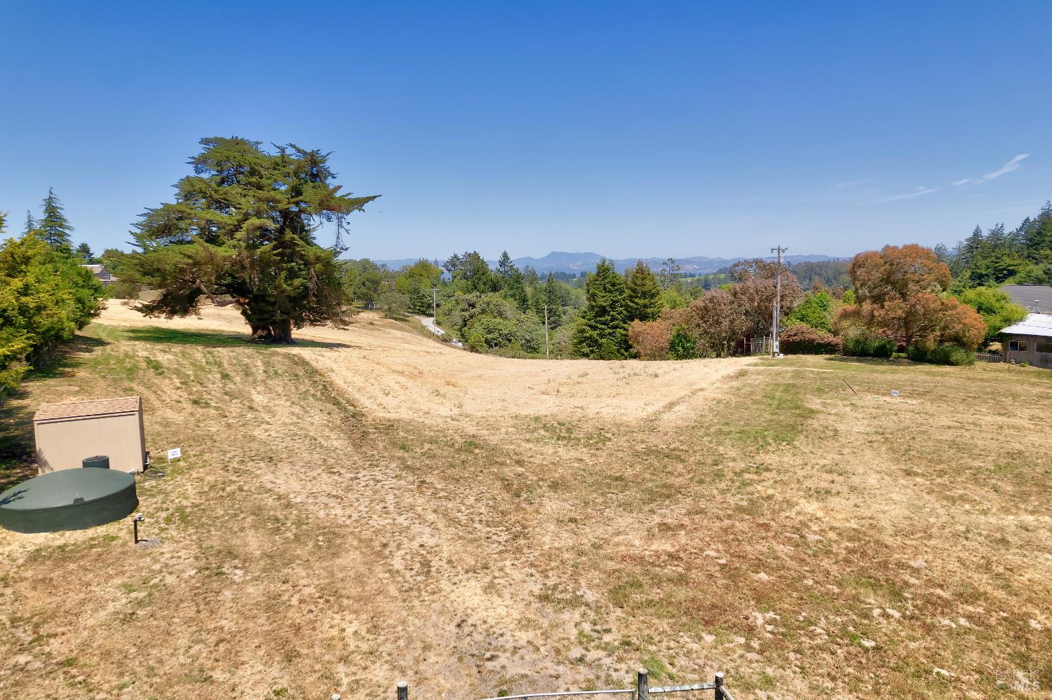10700 Barnett Valley Road Sebastopol, CA 95472 - Photo 19 of 21 a view of a yard with a house in the background