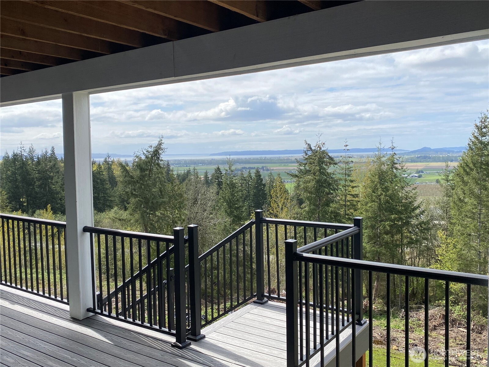 20555 Benson Ridge Mount Vernon, WA 98274 - Photo 33 of 40 a view of a balcony with wooden floor and fence