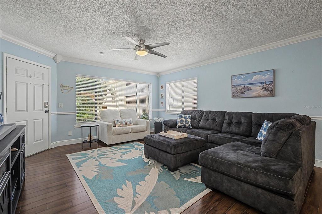 1550 South Belcher Road, Unit 525 Clearwater, FL 33764 - Photo 6 of 28 a living room with furniture and a large window