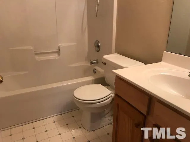 a bathroom with a toilet a sink and bathtub