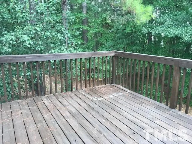 a view of balcony with wooden floor