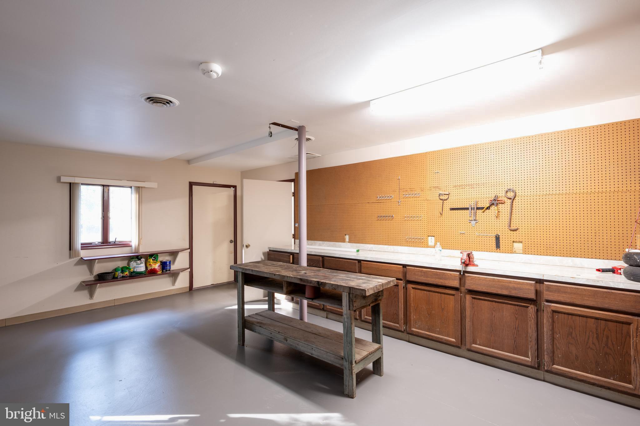 4419 Cooper Road Eden, MD 21822 - Photo 103 of 146 a room with lots of wooden furniture and a sink