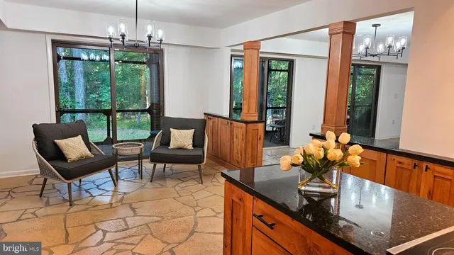 a view of walk in closet with wooden floor