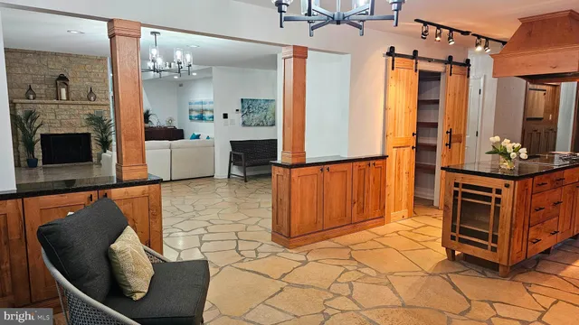 a bathroom with a sink vanity mirror bathtub and toilet