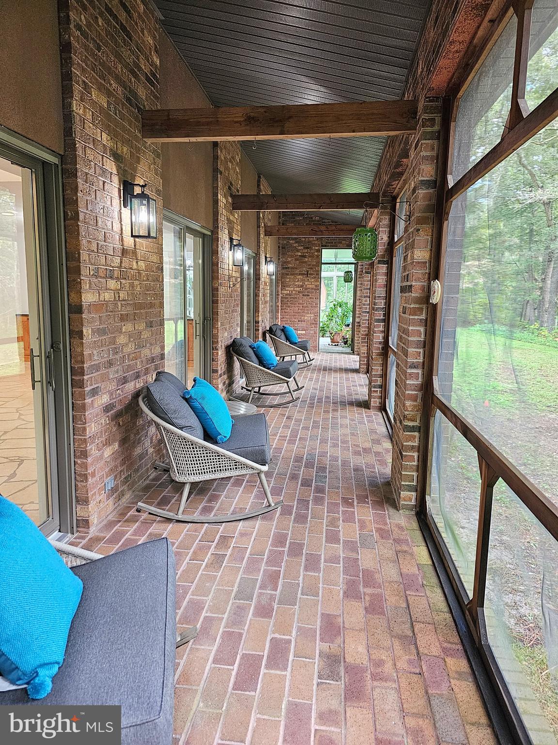 4419 Cooper Road Eden, MD 21822 - Photo 40 of 146 a living room with patio furniture and a floor to ceiling window