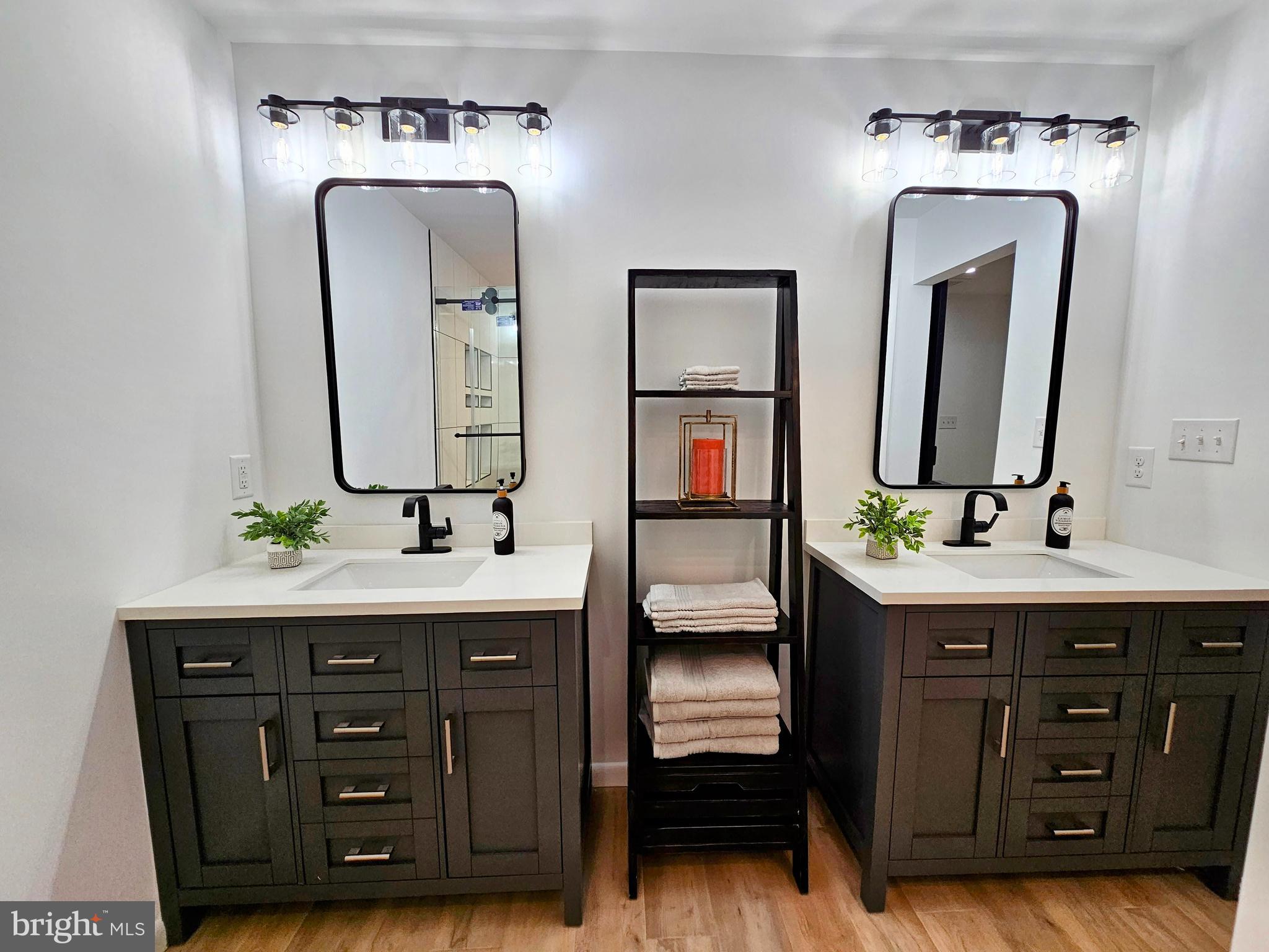 4419 Cooper Road Eden, MD 21822 - Photo 60 of 146 a bathroom with a double vanity sink double and mirror