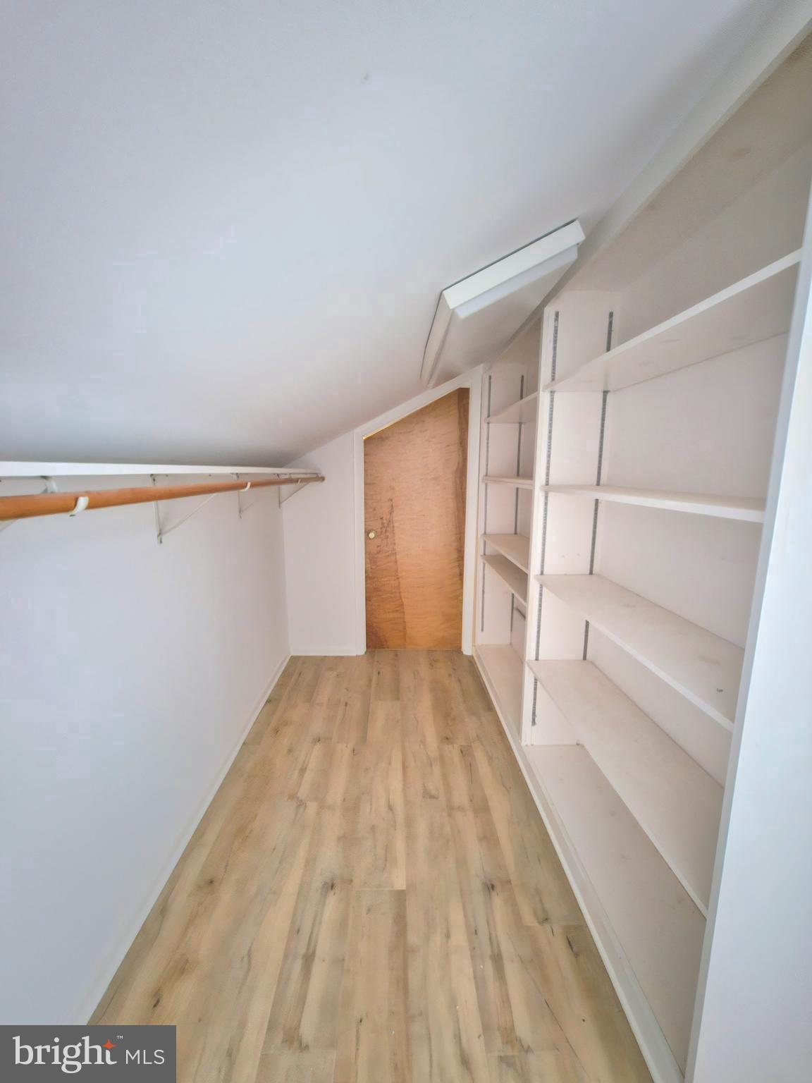4419 Cooper Road Eden, MD 21822 - Photo 66 of 146 a view of walk in closet with empty racks