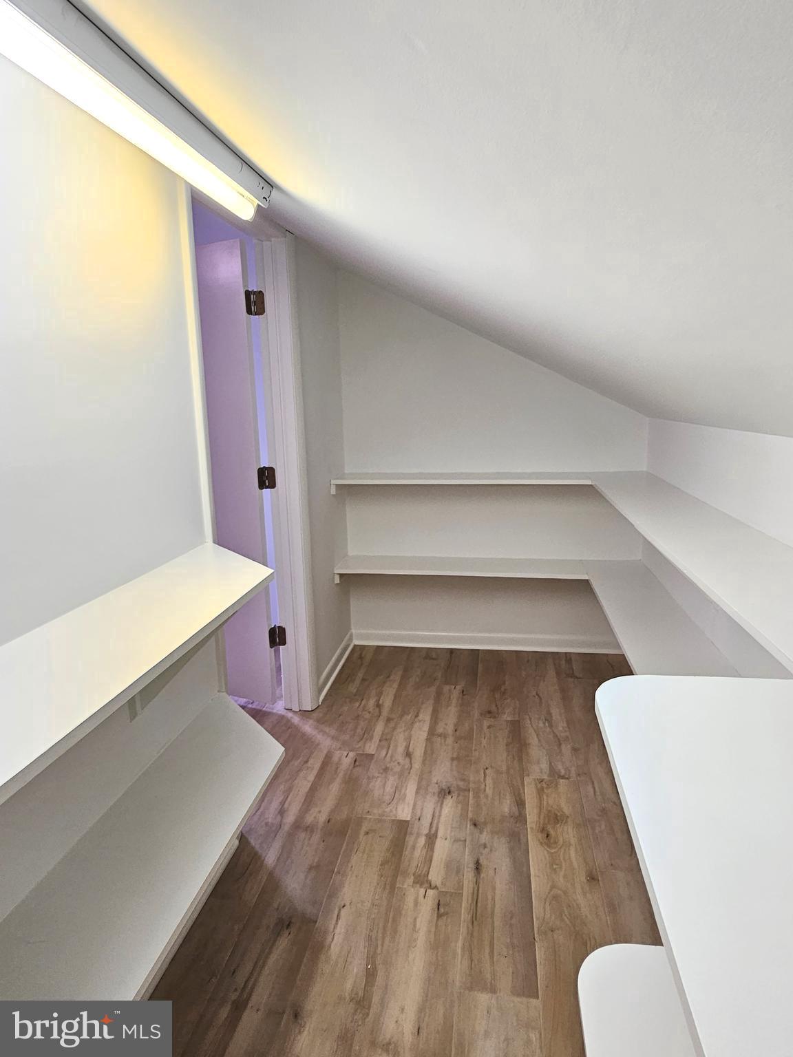 4419 Cooper Road Eden, MD 21822 - Photo 70 of 146 a view of walk in closet with wooden floor