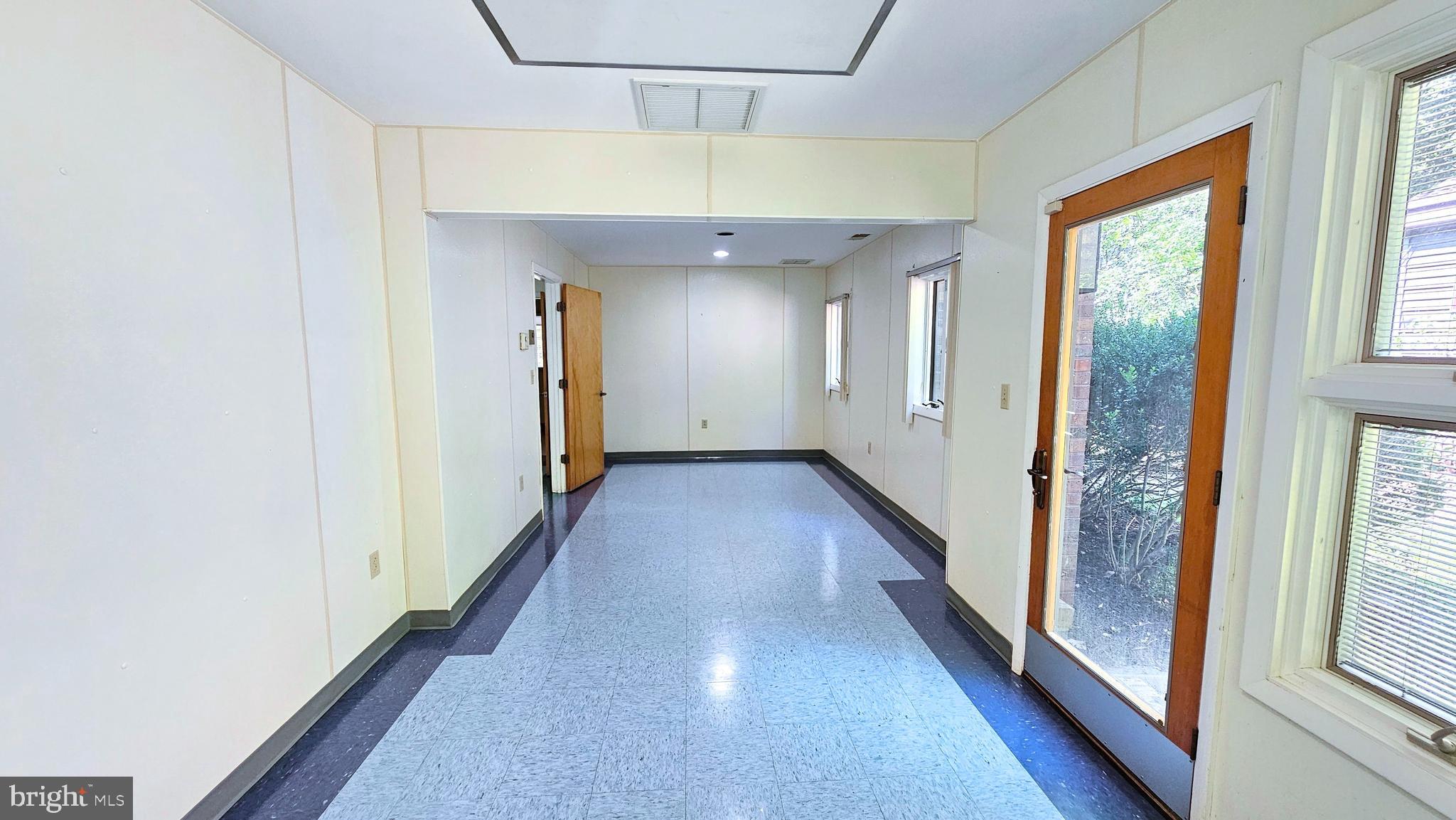 4419 Cooper Road Eden, MD 21822 - Photo 84 of 146 a view of a hallway with wooden floor and staircase