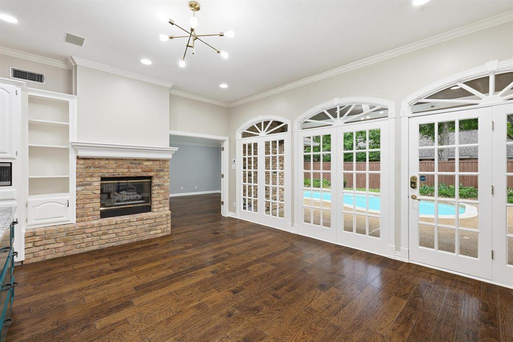 848 Birdsong Bedford, TX 76021 - Photo 14 of 40 a view of an empty room with wooden floor fireplace and a window