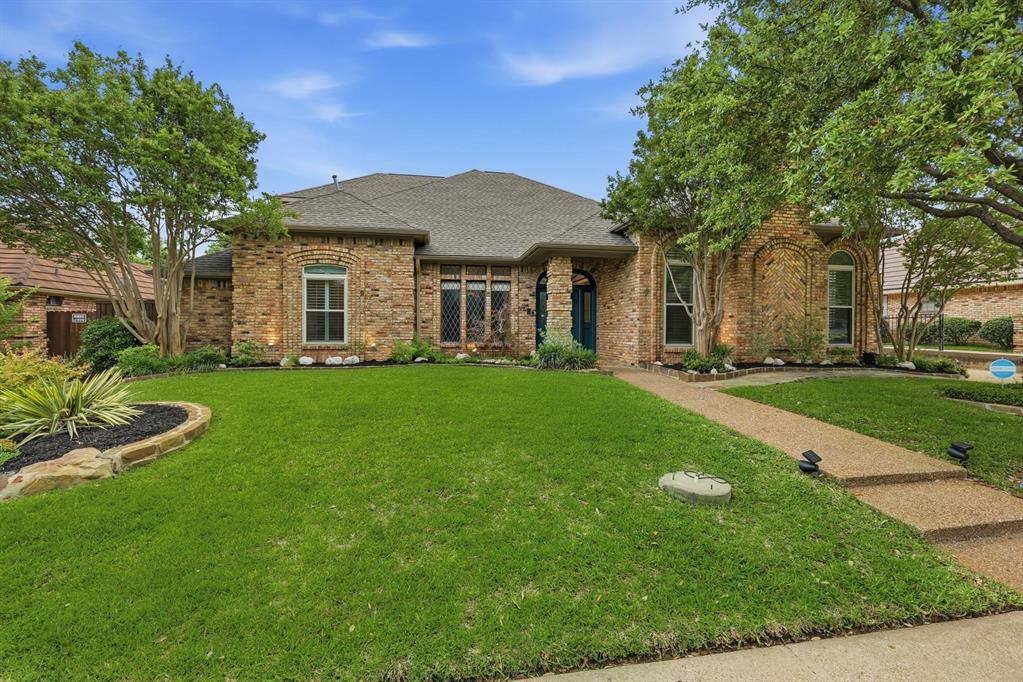 848 Birdsong Bedford, TX 76021 - Photo 2 of 40 a front view of a house with a yard and trees