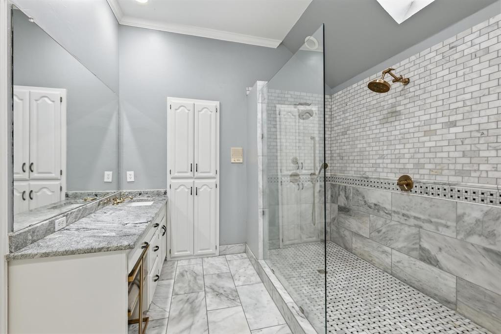 848 Birdsong Bedford, TX 76021 - Photo 22 of 40 a bathroom with a granite countertop sink and shower