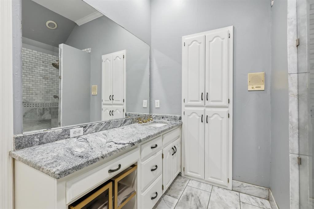 848 Birdsong Bedford, TX 76021 - Photo 23 of 40 a bathroom with a granite countertop sink and a mirror