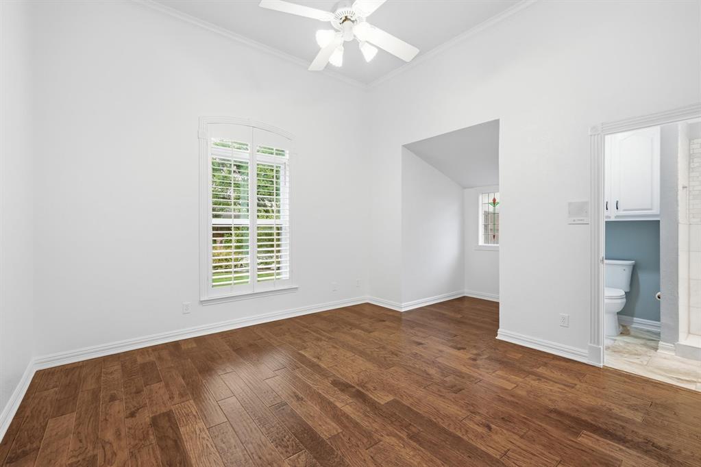 848 Birdsong Bedford, TX 76021 - Photo 33 of 40 a view of an empty room with wooden floor and a window
