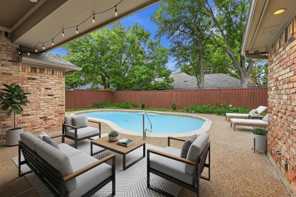 848 Birdsong Bedford, TX 76021 - Photo 38 of 40 an outdoor sitting area with couch and umbrella