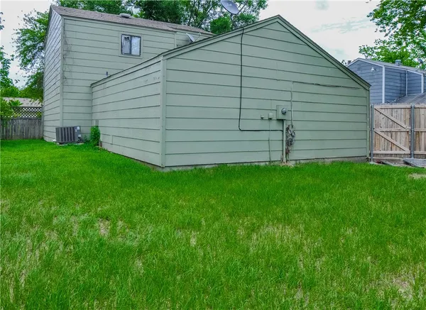 a view of a back yard of the house