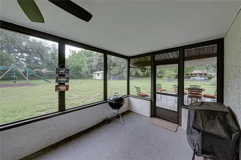 a view of a backyard with a garden and entertaining space