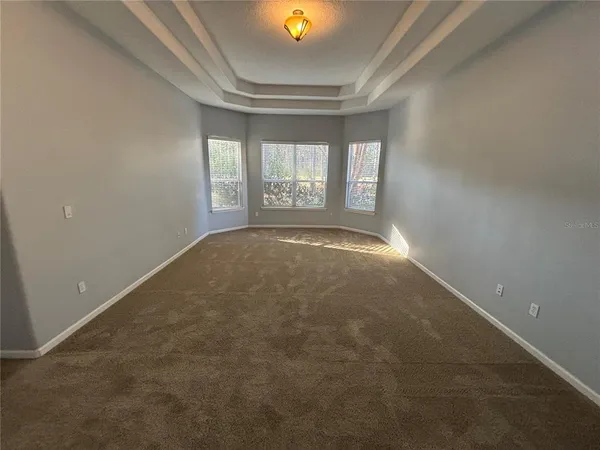 a kitchen with kitchen island granite countertop a sink and refrigerator