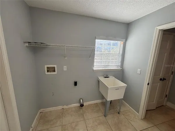 a kitchen with kitchen island a sink a counter and appliances