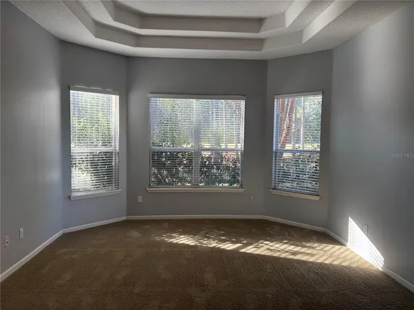 a view of an empty room and window