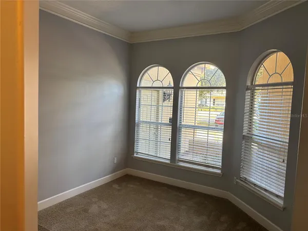 a view of empty room with windows