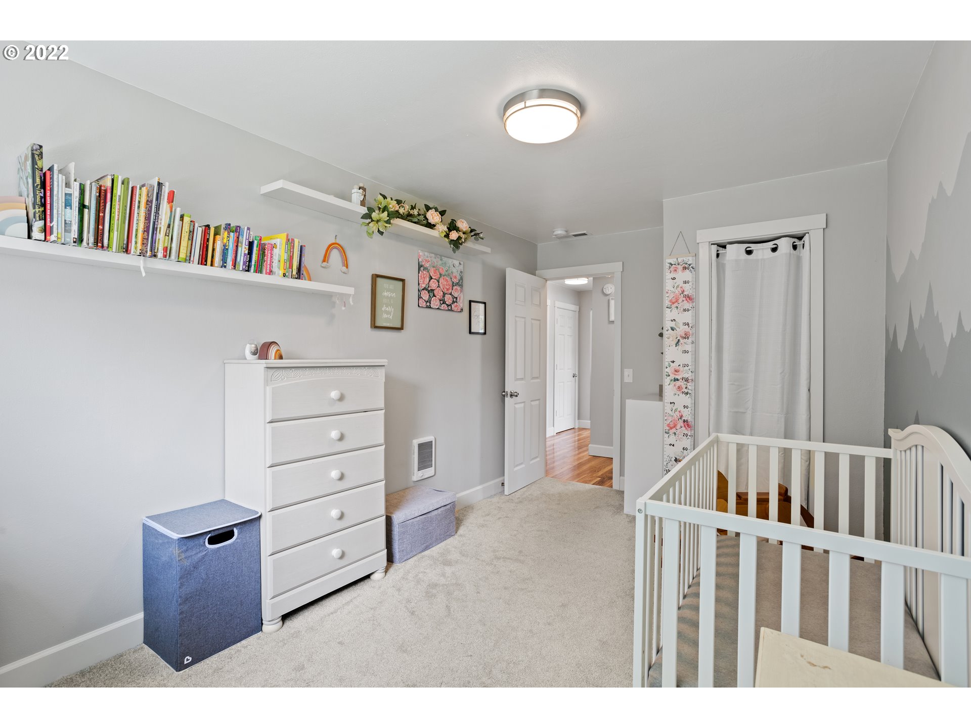 1174 Southwest Maple Street Dallas, OR 97338 - Photo 19 of 32 a view of a bedroom with baby crib and lounge chair