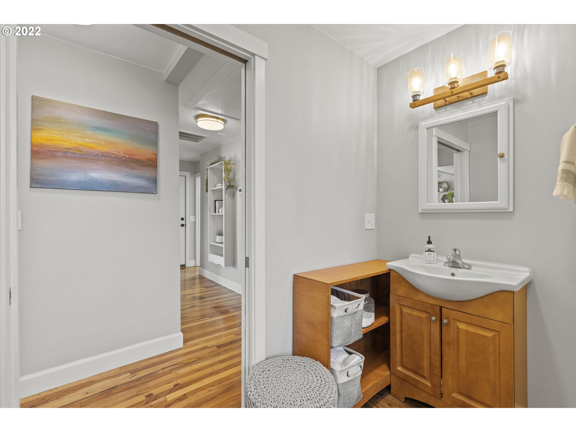 1174 Southwest Maple Street Dallas, OR 97338 - Photo 24 of 32 a bathroom with a sink a light fixture and a mirror