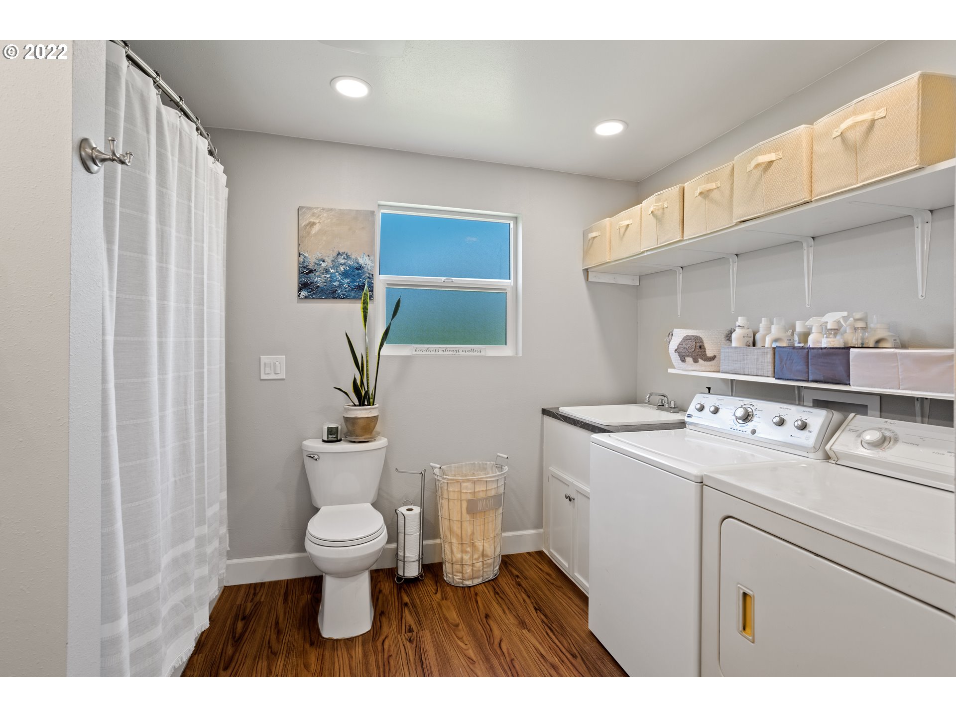 1174 Southwest Maple Street Dallas, OR 97338 - Photo 25 of 32 a bathroom with a sink a toilet and a mirror