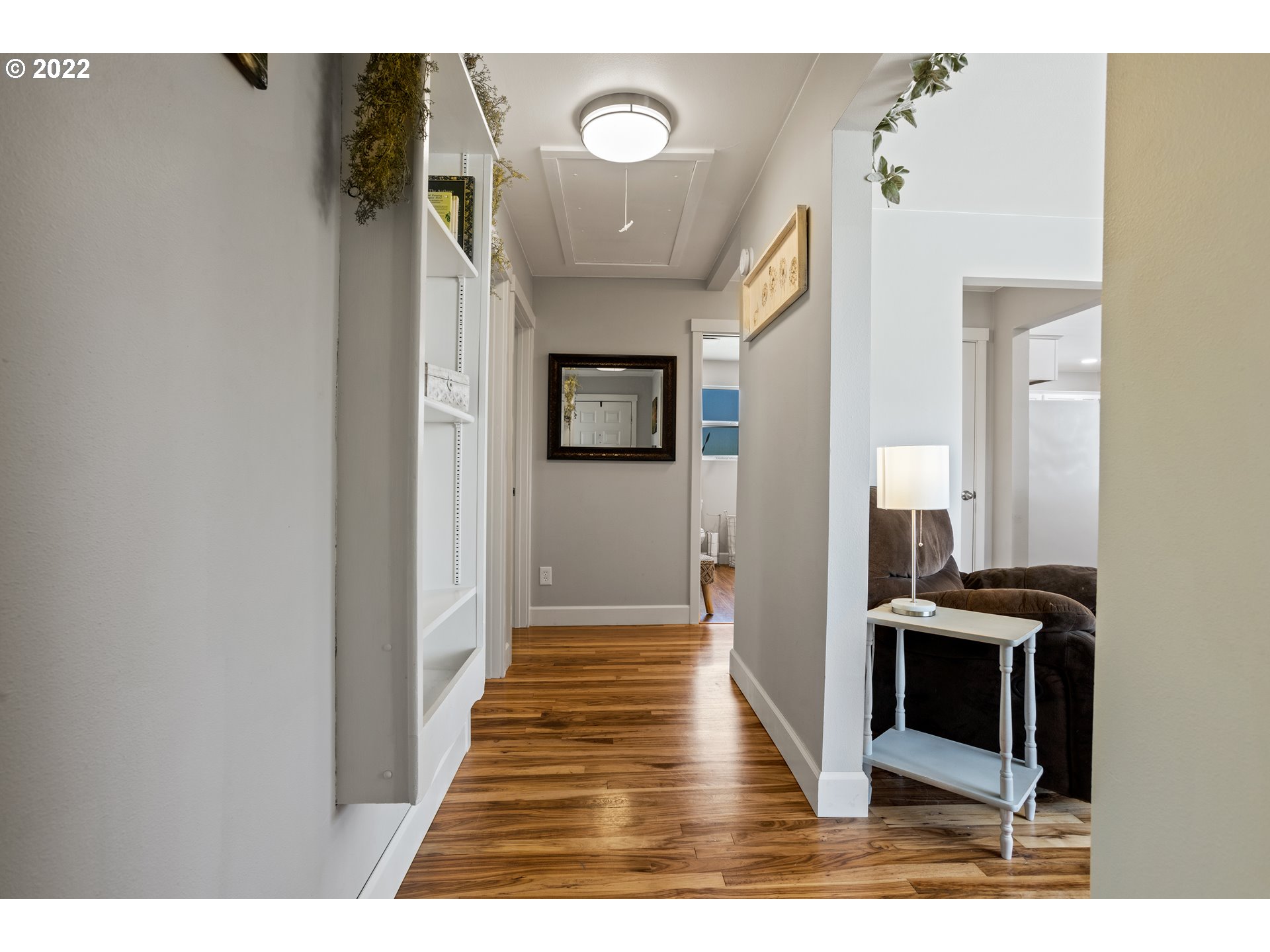 1174 Southwest Maple Street Dallas, OR 97338 - Photo 3 of 32 a view of a hallway with wooden floor and staircase