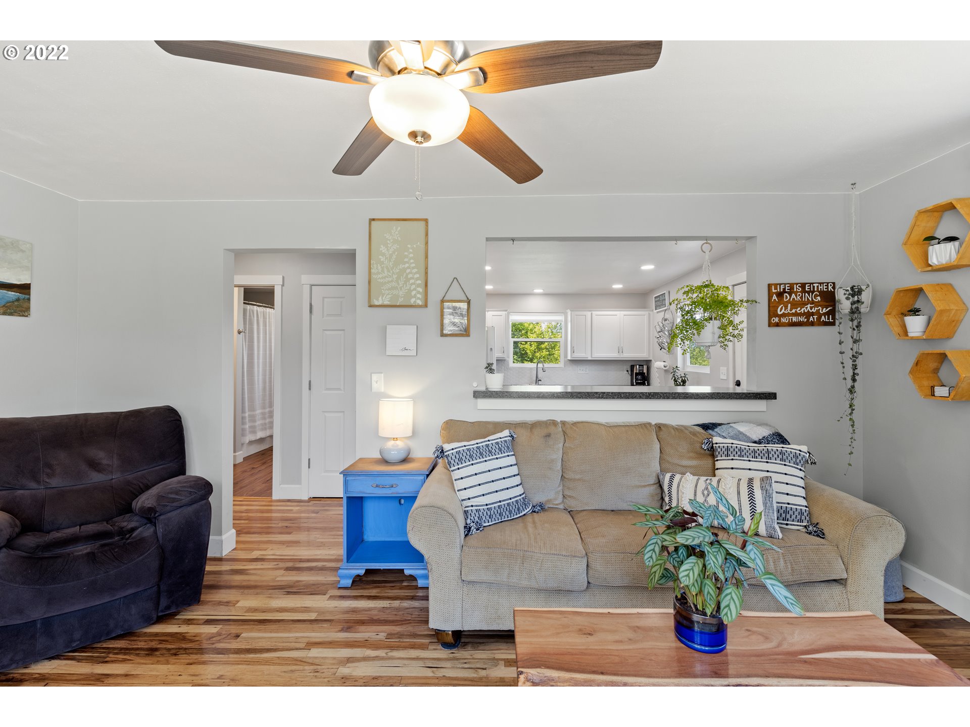 1174 Southwest Maple Street Dallas, OR 97338 - Photo 8 of 32 a living room with furniture and a chandelier