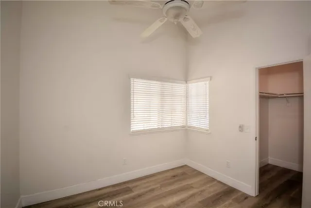 a bathroom with a granite countertop sink a toilet and a mirror