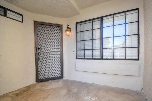 a view of a room that has a large window in it