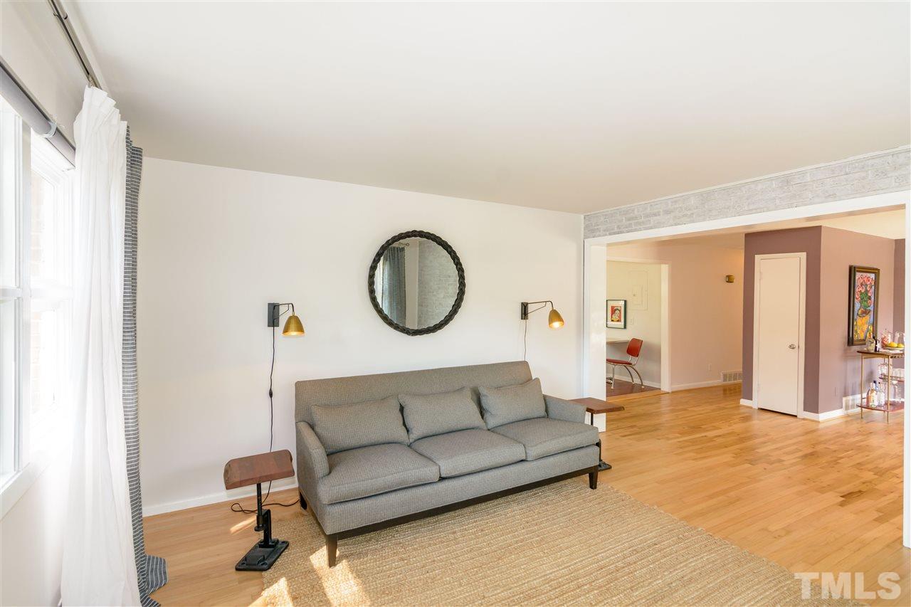 1800 Charles Raleigh, NC 27610 - Photo 11 of 28 a living room with furniture a mirror and white walls