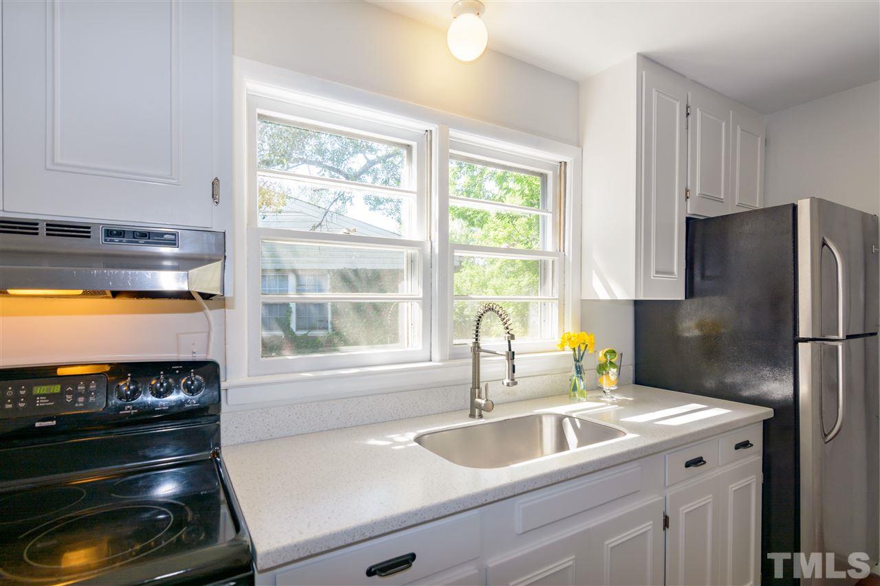 1800 Charles Raleigh, NC 27610 - Photo 14 of 28 a kitchen with a sink stove and refrigerator
