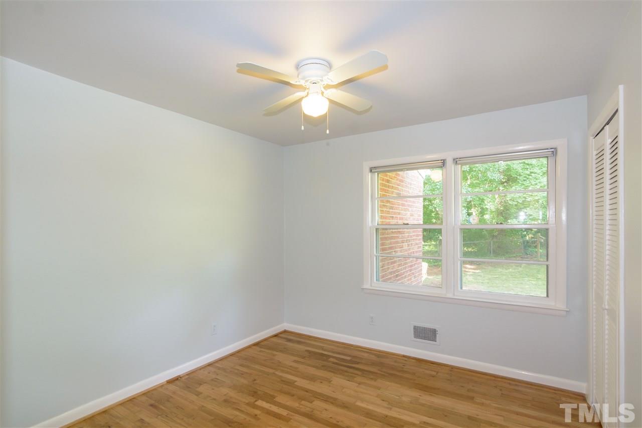 1800 Charles Raleigh, NC 27610 - Photo 18 of 28 a view of an empty room with wooden floor and a window