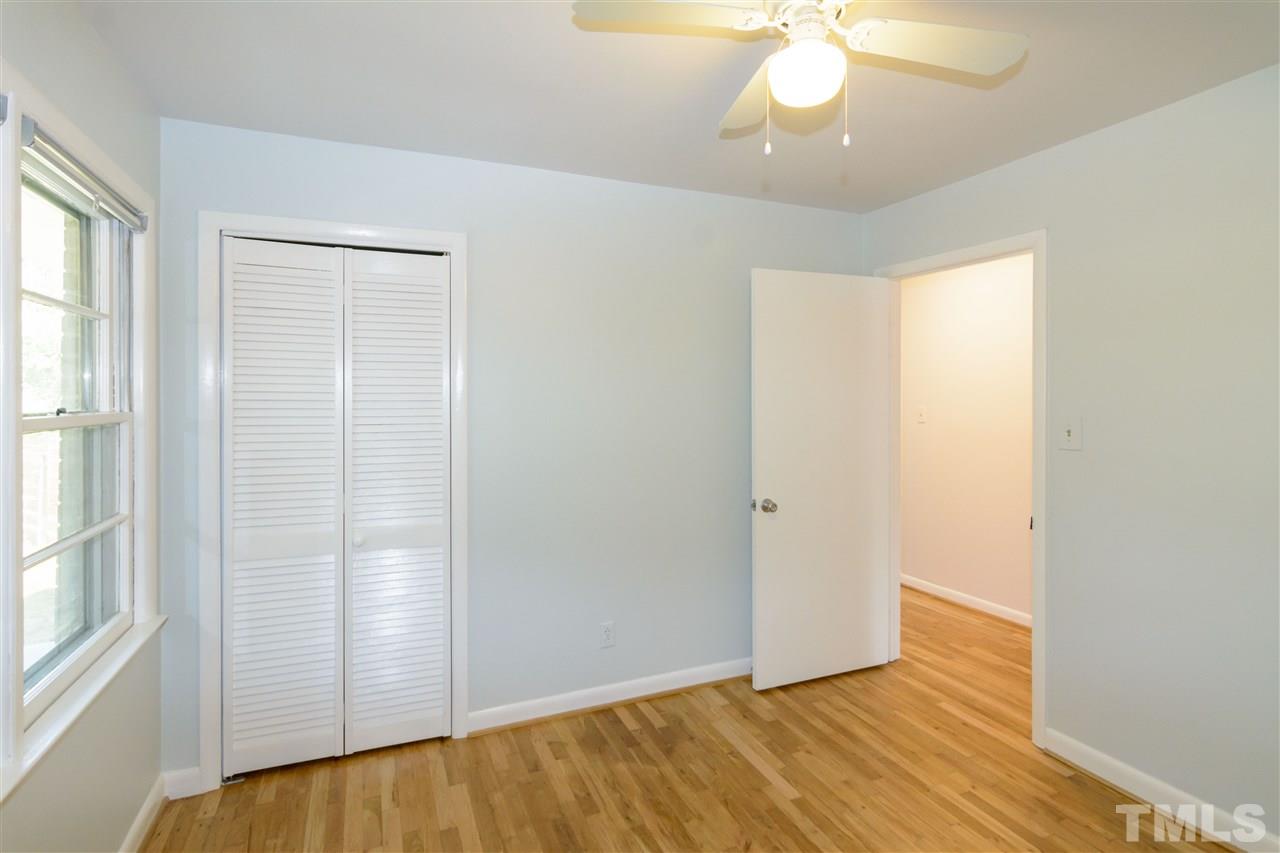 1800 Charles Raleigh, NC 27610 - Photo 19 of 28 a view of an empty room with wooden floor and a window