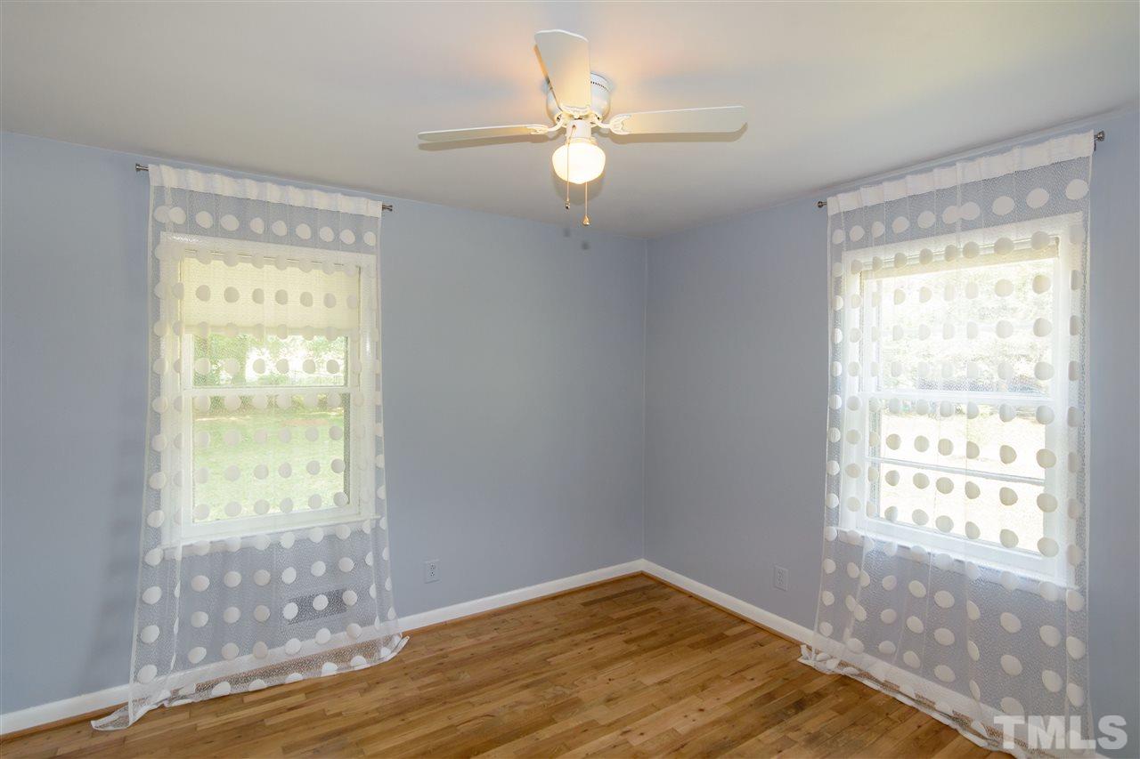 1800 Charles Raleigh, NC 27610 - Photo 22 of 28 a view of an empty room with wooden floor and a window