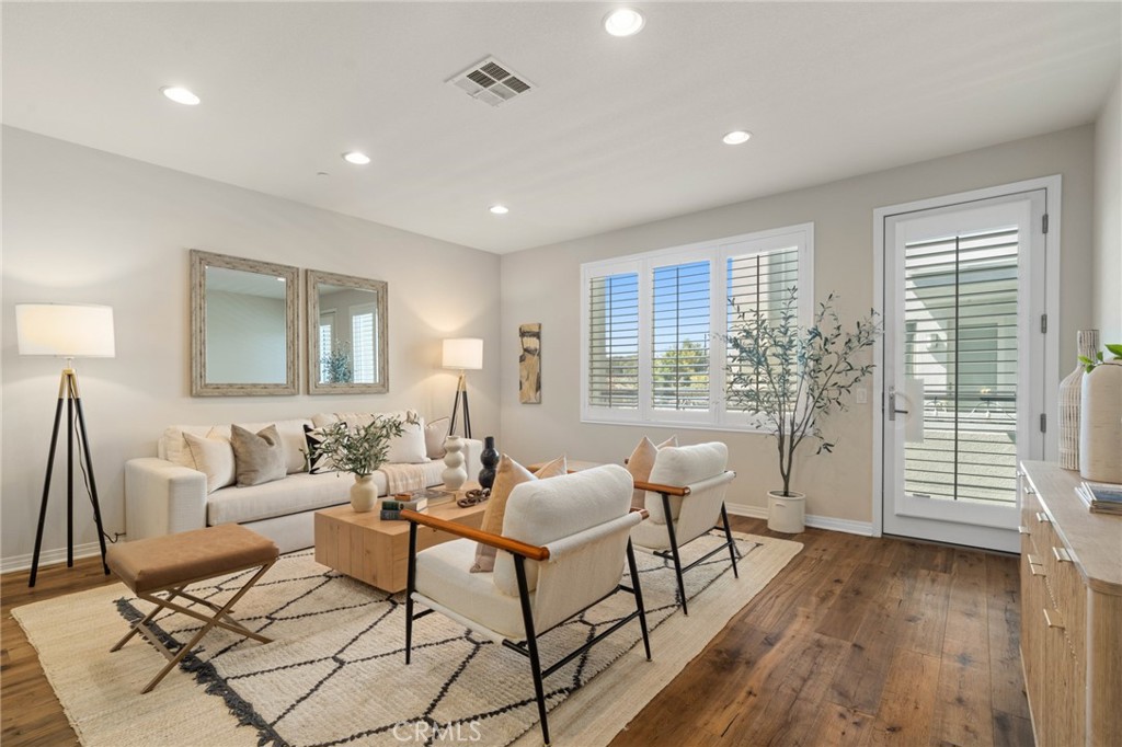12913 Mission Hawthorne Ca, Unit 108 Hawthorne, CA 90250 - Photo 1 of 31 a living room with furniture and a window