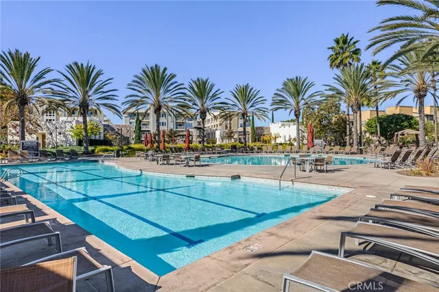 a swimming pool with outdoor seating