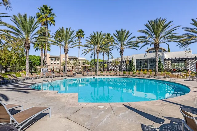 a view of a backyard and swimming pool