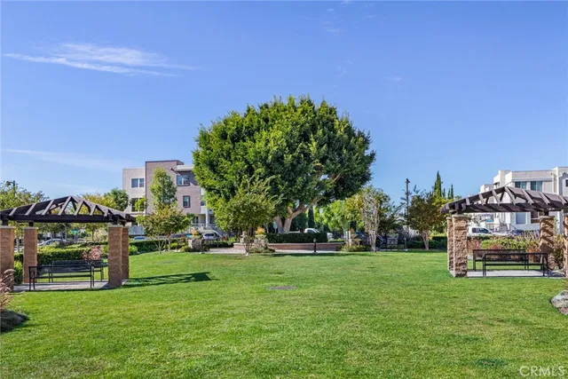 a view of a park with large trees