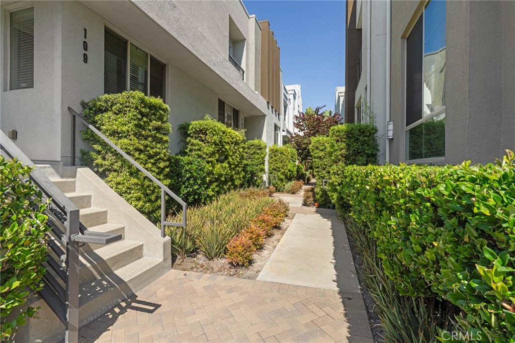 12913 Mission Hawthorne Ca, Unit 108 Hawthorne, CA 90250 - Photo 3 of 31 a view of a pathway both side of house