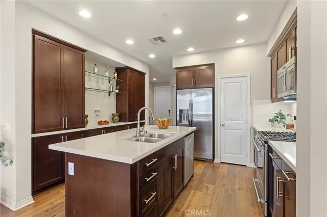a kitchen with a sink stove and refrigerator