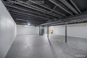 11211 Boyce Road Chelsea, MI 48118 - Photo 18 of 22 Spacious unfinished basement featuring painted concrete flooring, painted joists, and exposed ductwork