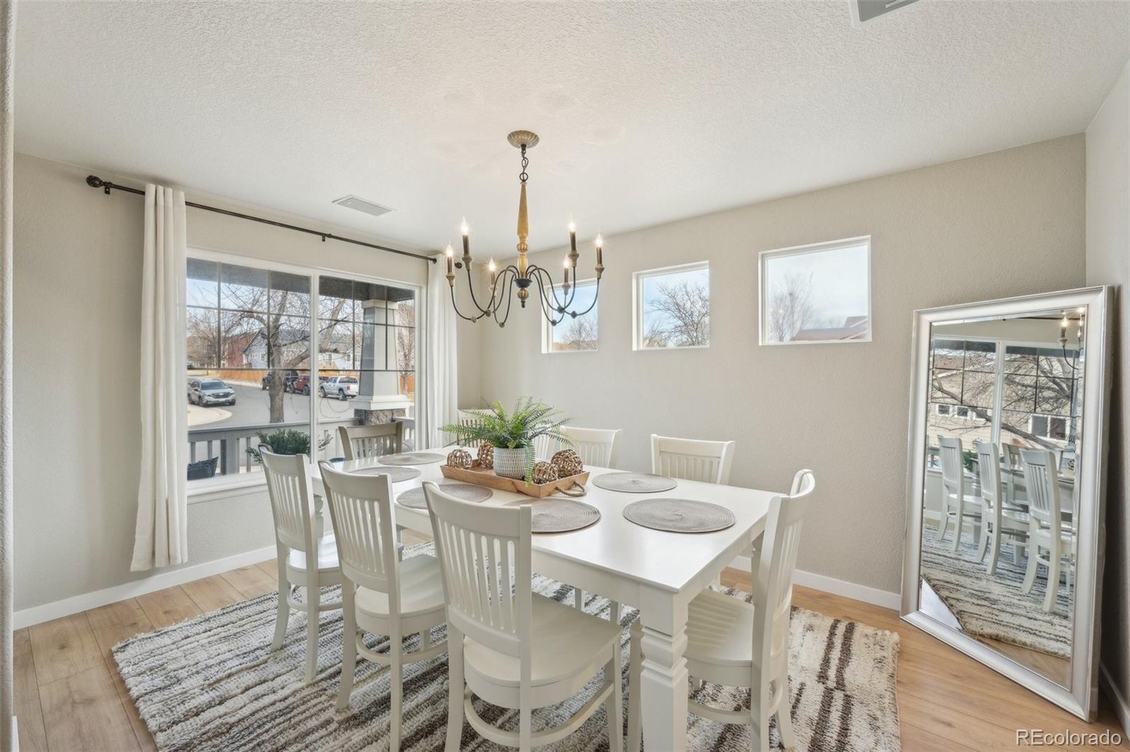 591 Rio Rancho Way Brighton, CO 80601 - Photo 12 of 47 a view of a dining room with furniture window and outside view