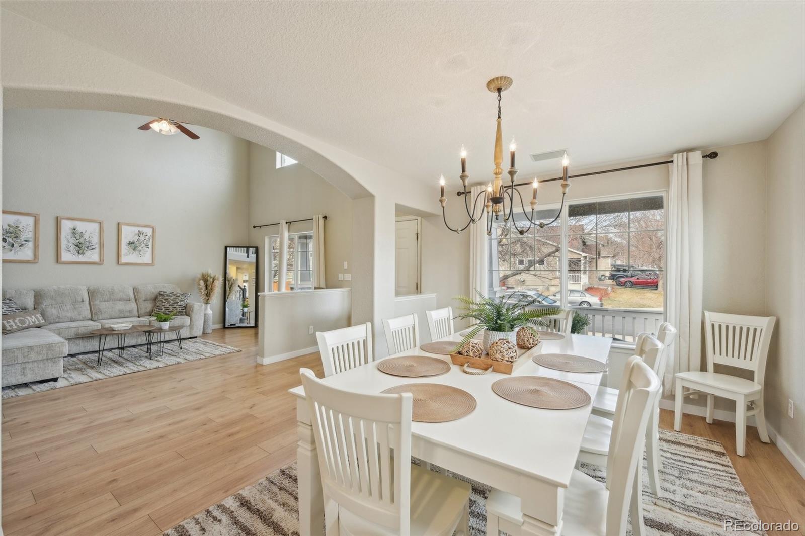 591 Rio Rancho Way Brighton, CO 80601 - Photo 13 of 47 a view of a dining room with furniture window and wooden floor