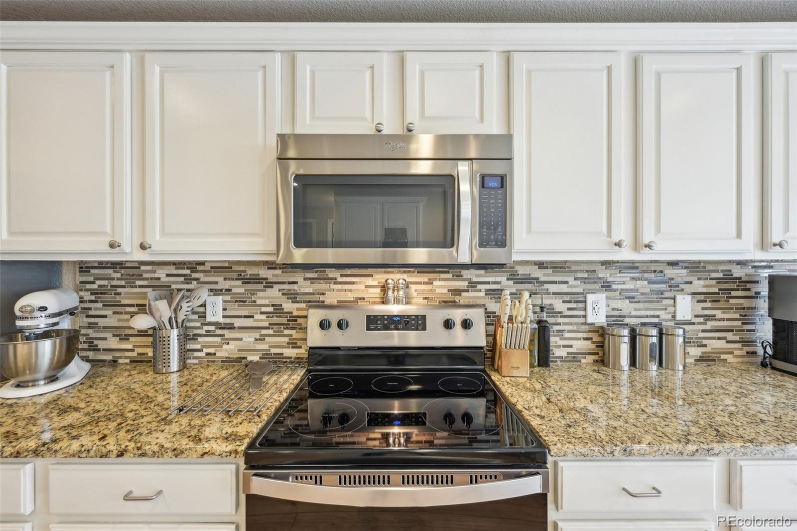 591 Rio Rancho Way Brighton, CO 80601 - Photo 21 of 47 a stove top oven sitting inside of a kitchen
