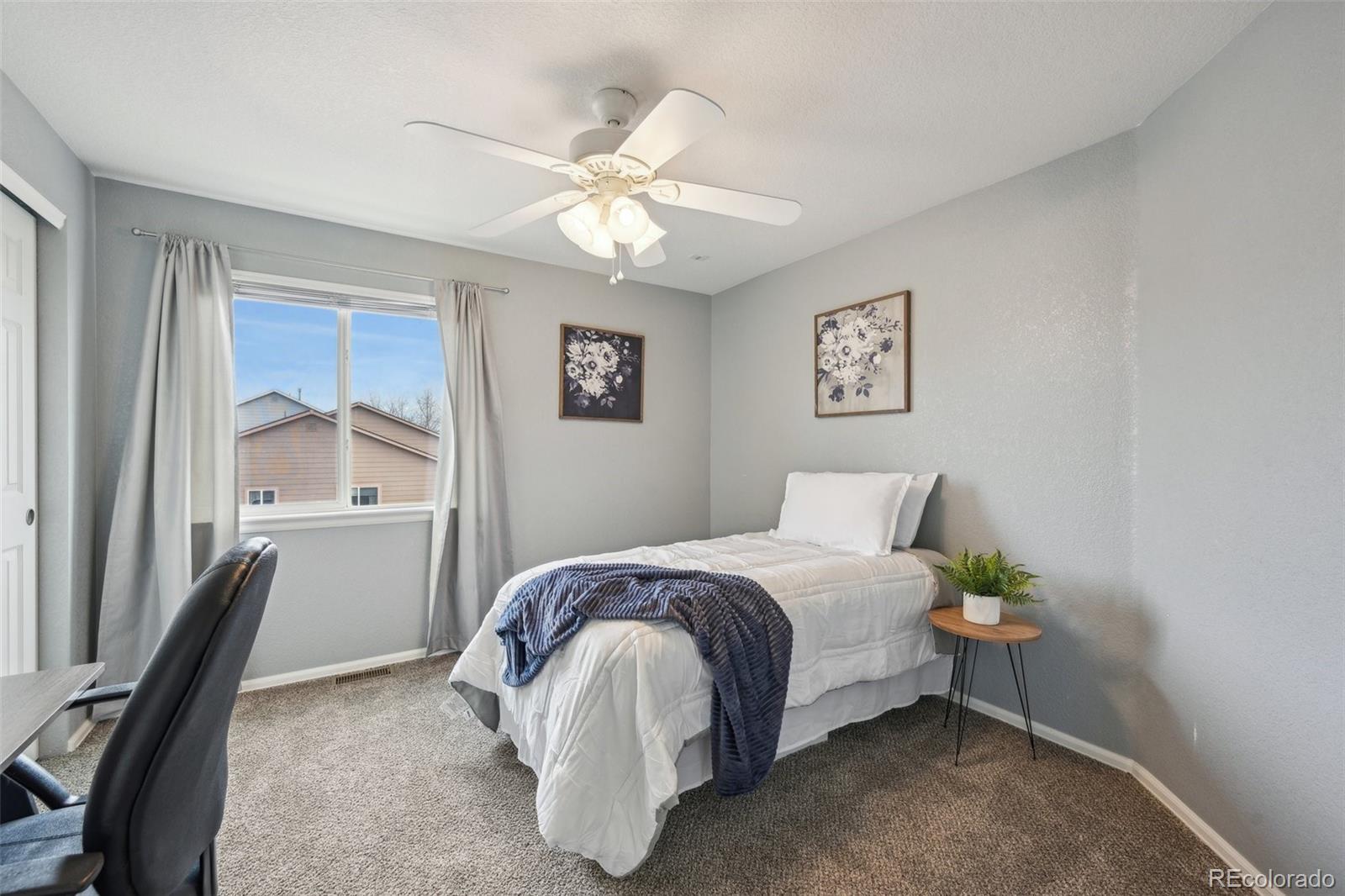 591 Rio Rancho Way Brighton, CO 80601 - Photo 31 of 47 a bedroom with a bed and a window